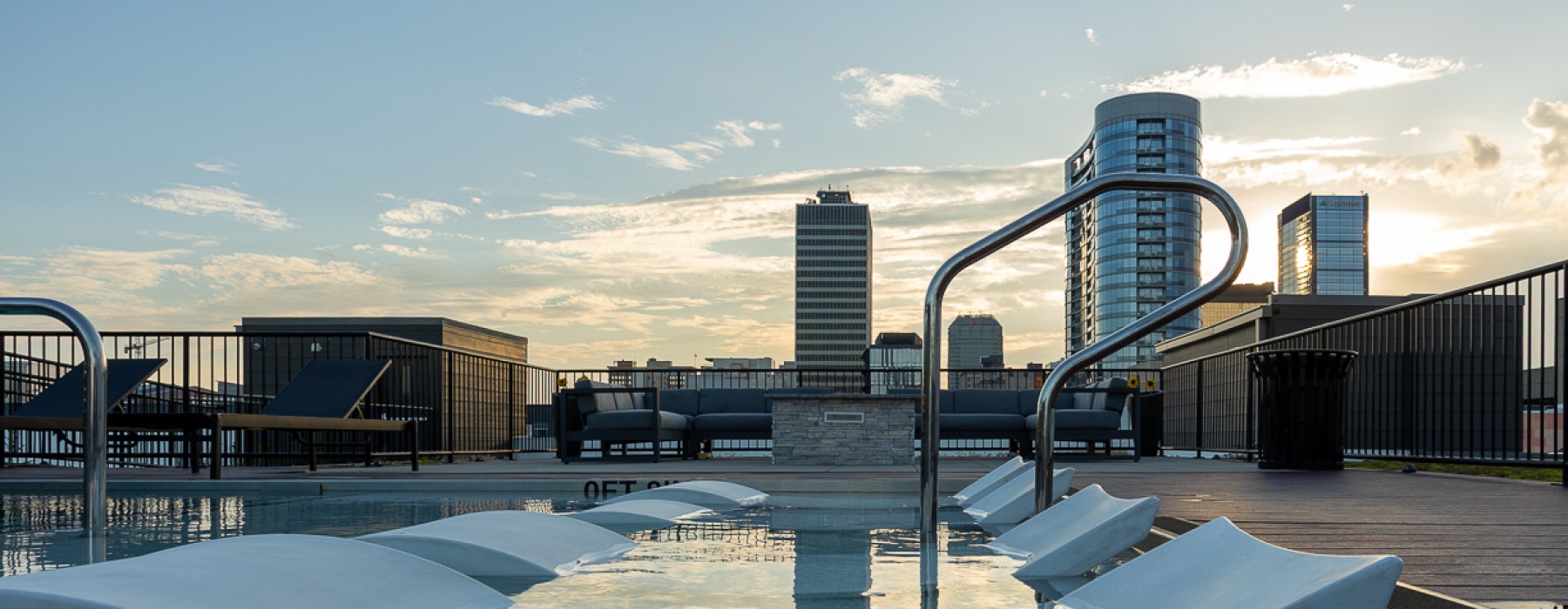 Swimming pool with sundeck and views of Indy skyline